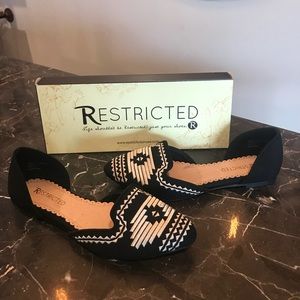 Black Aztec print flats. Never been worn.